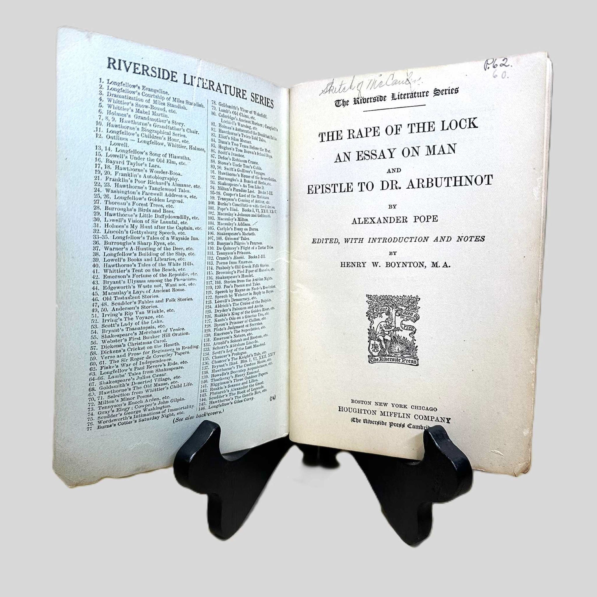 Inside front cover view of The Rape of the Lock by Alexander Pope centered on a neutral light gray background. 