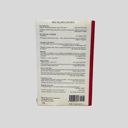 Back cover view of The Sands of Time by Sidney Sheldon centered on a neutral light gray background.  Dust jacket is present with no damage.