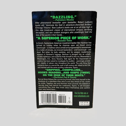 Back cover view of The Sigma Protocol by Robert Ludlum centered on a neutral light gray background. Minor chipping along bottom edge of back cover.