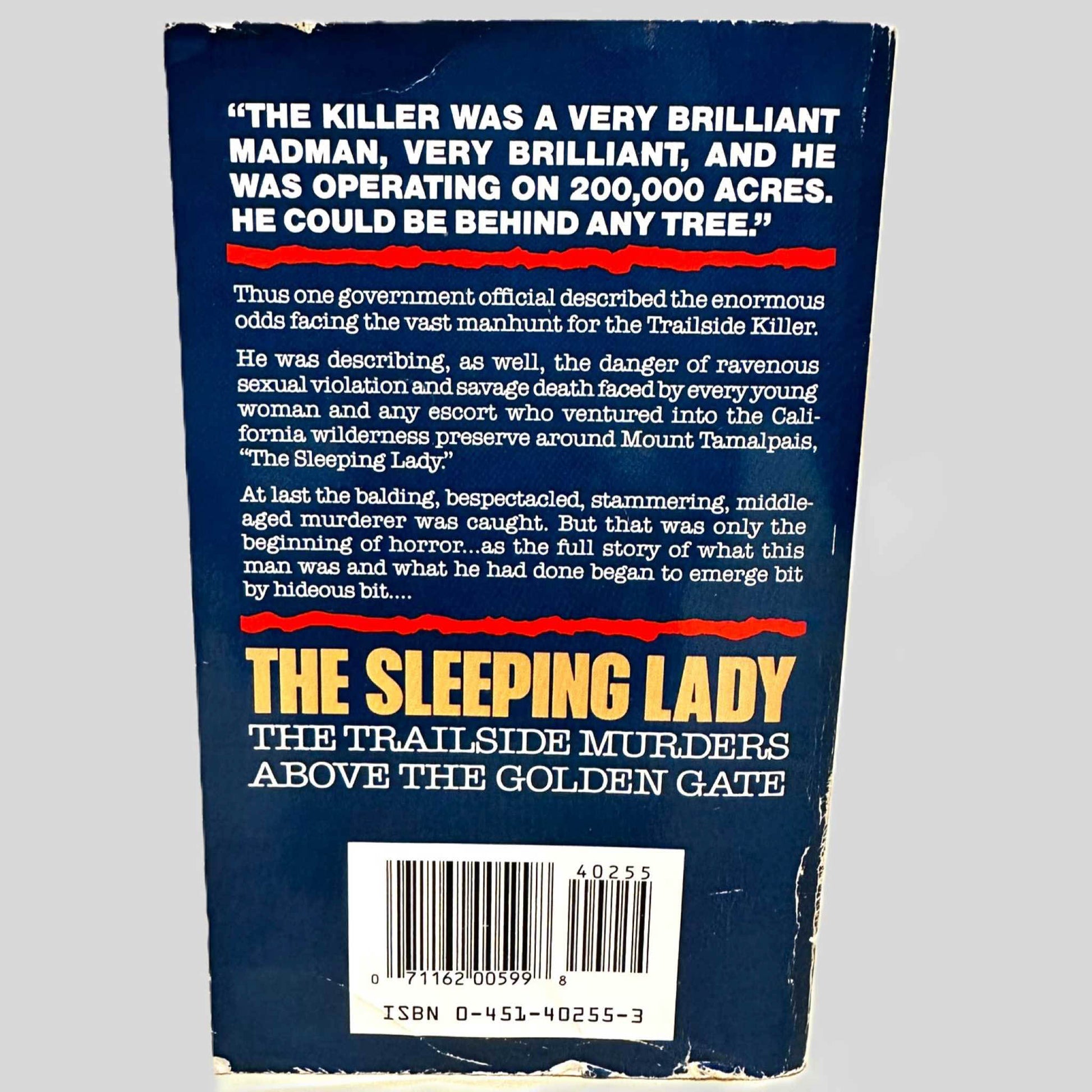 Back cover view of The Sleeping Lady by Robert Graysmith centered on a neutral light gray background. Back cover shows chipping.
