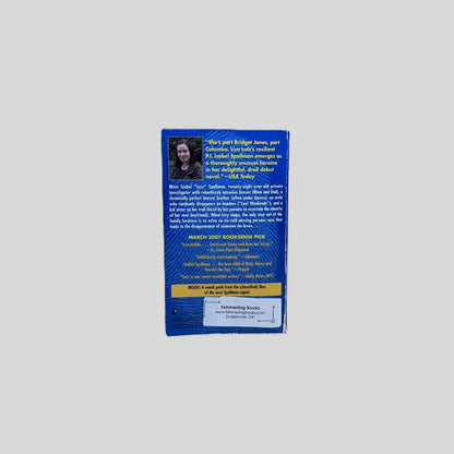 Back cover view of The Spellman Files by Lisa Lutz centered on a neutral light gray background. Chipping to the bottom corner of the spine. Creasing along the  length of the spine edge.