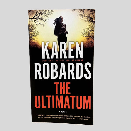 Front cover view of The Ultimatum by Karen Robards centered on a neutral light gray background. 