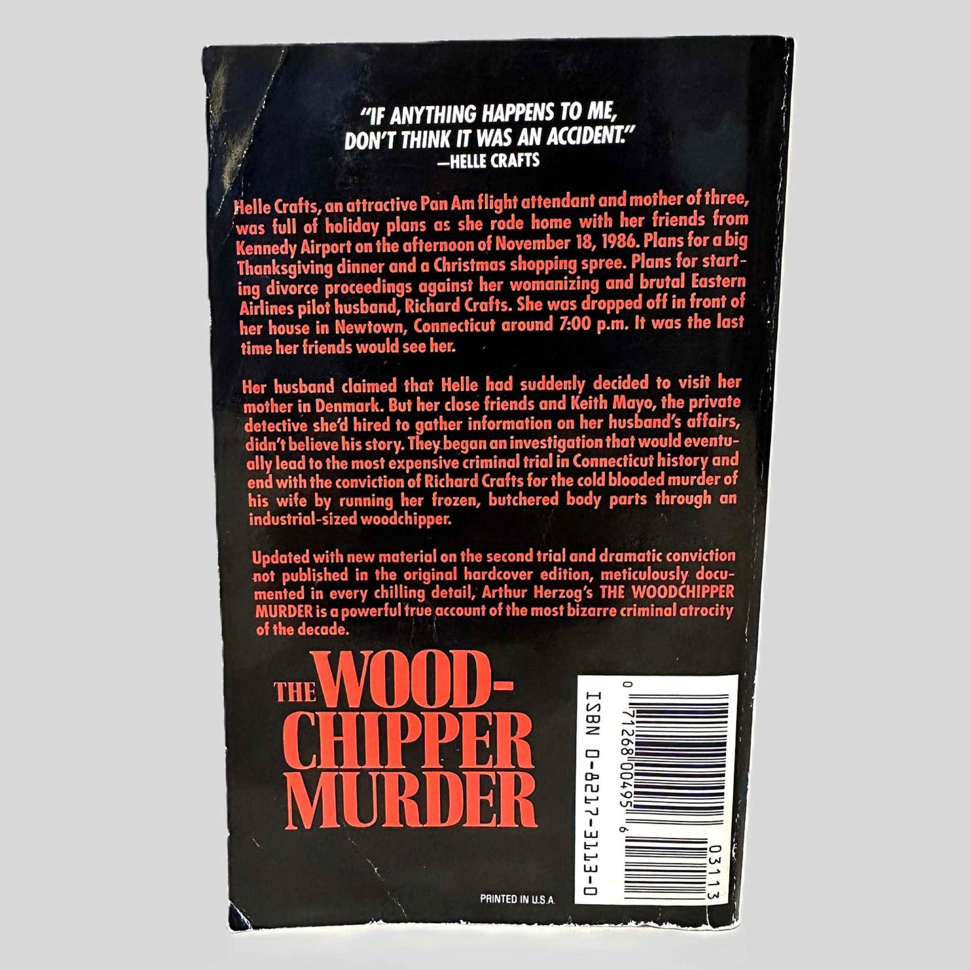 Back cover view of The Woodchipper Murder by Arthur Herzog centered on a neutral light gray background. 
