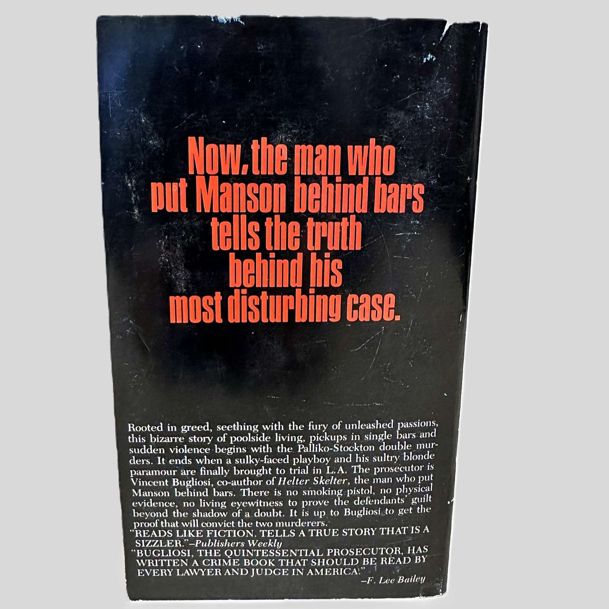 Back cover view of Till Death Us Do Part by Vincent Bugliosi & Ken Hurwitz centered on a neutral light gray background. Cover shows wear and rubbing.