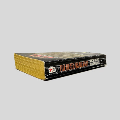 Close-up spine view of Till Death Us Do Part by Vincent Bugliosi & Ken Hurwitz centered on a neutral light gray background. Spine is square and shows creasing.