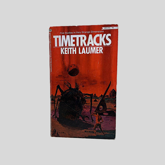 Front cover view of Timetracks by Keith Laumer centered on a neutral light gray background. Chipping around edges.