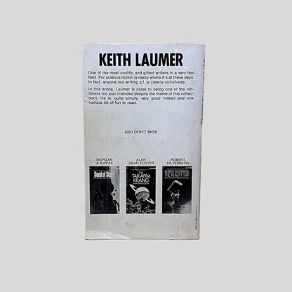 Back cover view of Timetracks by Keith Laumer centered on a neutral light gray background. Minor chipping around edges, creasing on bottom left corner.