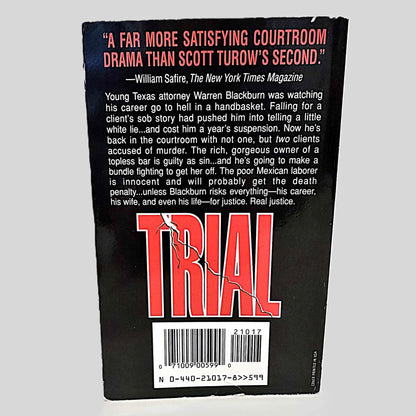 Back cover view of Trial by Clifford Irving centered on a neutral light gray background. Shows some minor chipping around the cover edges.
