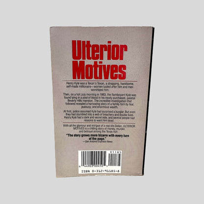 Back cover view of Ulterior Motives by Suzanne Finstad centered on a neutral light gray background. 