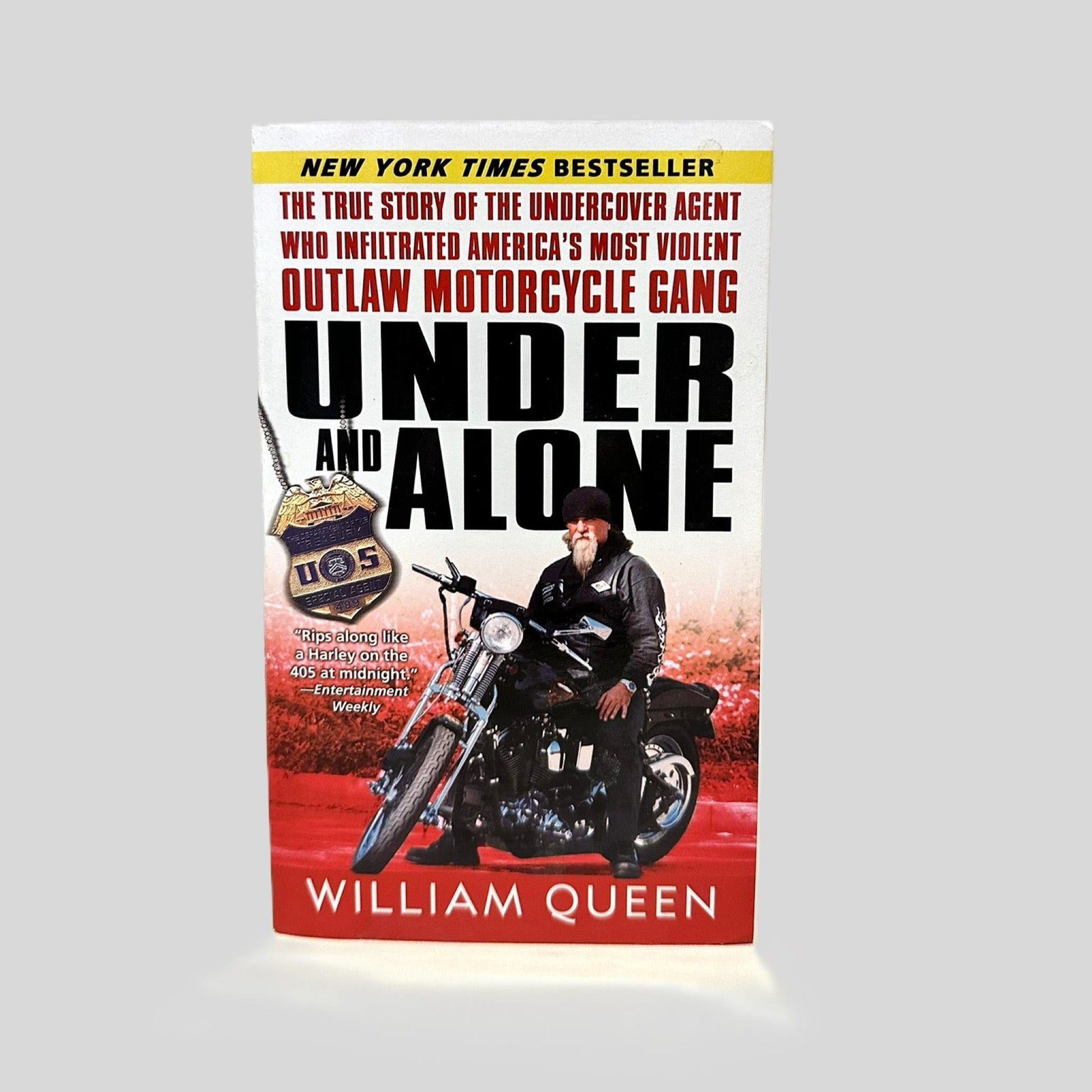 Front cover view of Under and Alone by William Queen centered on a neutral light gray background.
