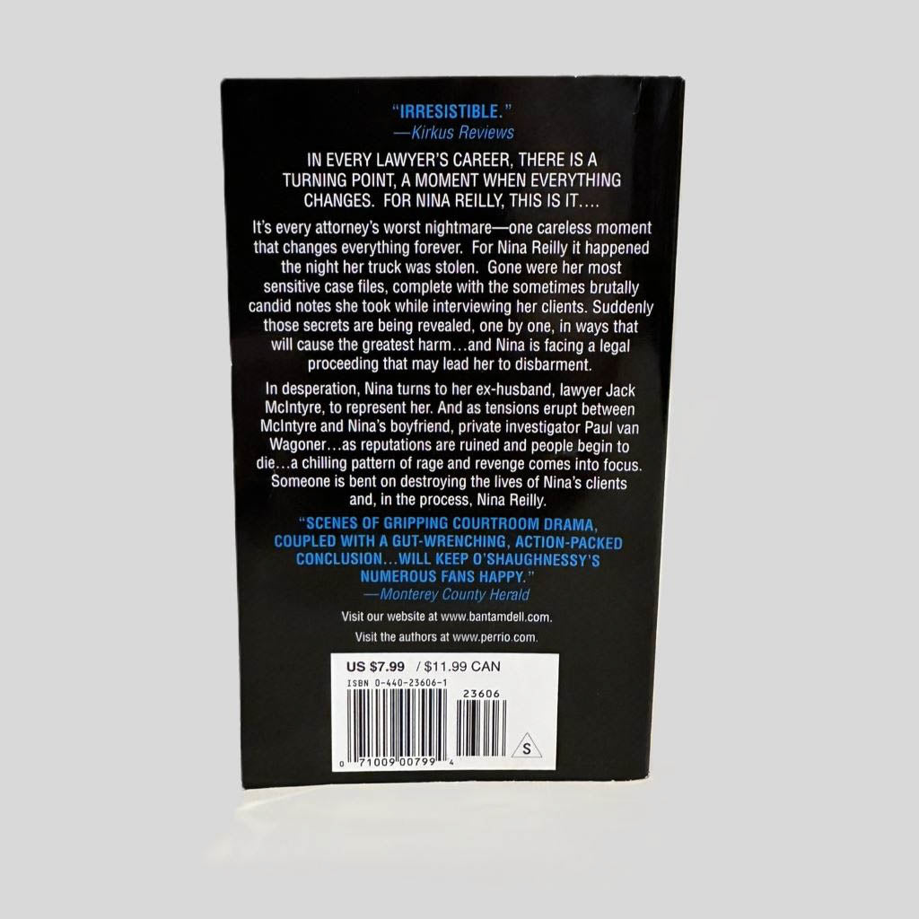 Back cover view of Unfit to Practice by Perri O'Shaughnessy centered on a neutral light gray background. 