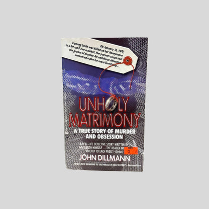 Front cover view of Unholy Matrimony by John Dillmann centered on a neutral light gray background. 