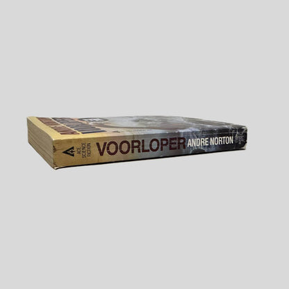 Close-up spine view of Voorloper by Andre Norton centered on a neutral light gray background. Spine shows minimal creasing. Chipping to the each end of the spine. Pages lay flat.