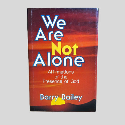 Front cover view of We Are Not Alone by Barry Bailey centered on a neutral light gray background. Dust jack is present. Some rubbing by the spine edge. Cover art is vibrant. 