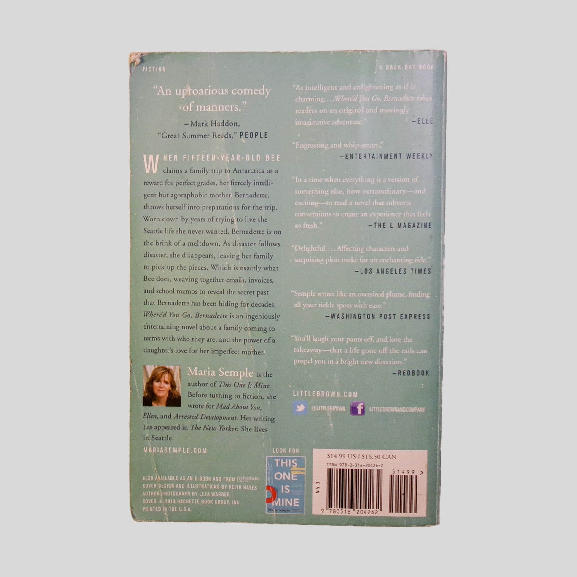 Back cover view of Where'D You Go Bernadette by Maria Semple centered on a neutral light gray background. Chipping to the corners. Significant chipping to the top left corner. Creasing also present.