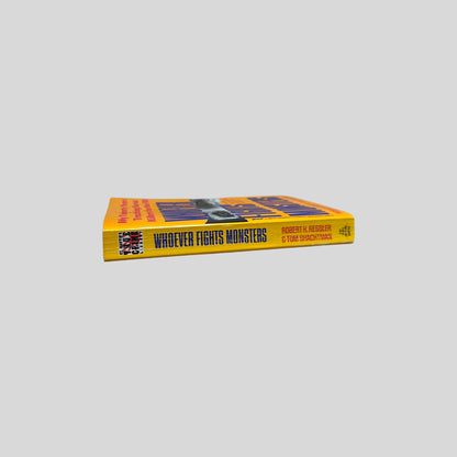 Close-up spine view of Whoever Fights Monsters by Ressler and Shachtman centered on a neutral light gray background. 