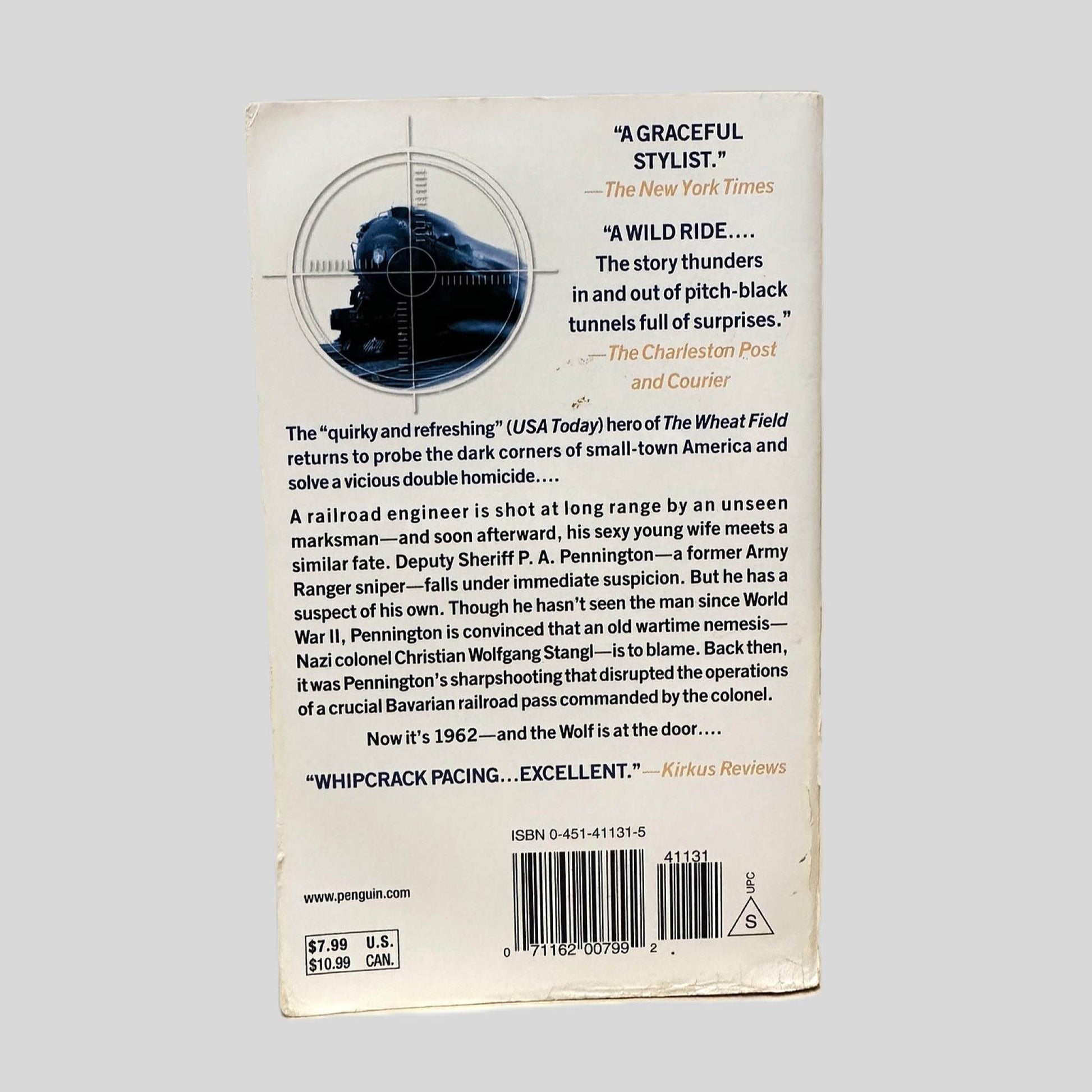 Back cover view of Wolf Pass by Steve Thayer centered on a neutral light gray background. Chipping along the bottom edge.