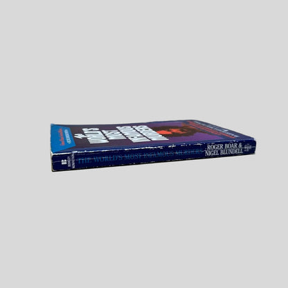 Close-up spine view of World's Most Famous Murders by Boar and Blundell centered on a neutral light gray background. Spine is square with some creasing and rubbing.