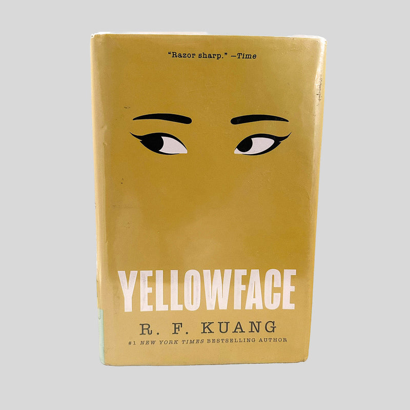 Front cover view of Yellowface by R. F. Kuang centered on a neutral light gray background. Dust jacket is present and pristine, wrapped in a mylar cover.