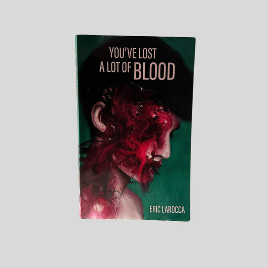 Front cover view of You've Lost A Lot of Blood by Eric LaRocca centered on a neutral light gray background. Chipping is present along the edges.
