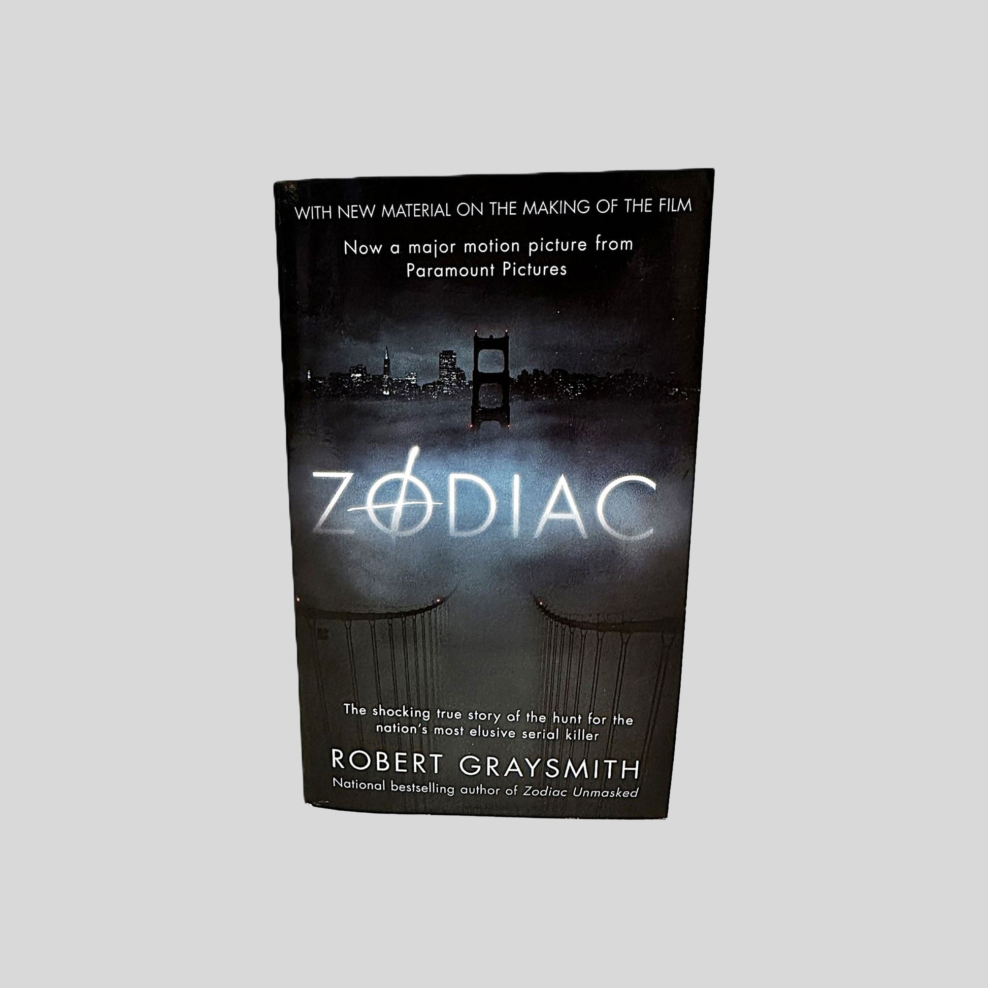 Front cover view of Zodiac by Robert Graysmith centered on a neutral light gray background. 