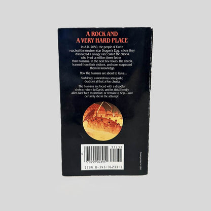Back cover view of  Starquake by Robert L. Forward centered on a neutral light gray background. Creasing near the spine edge.