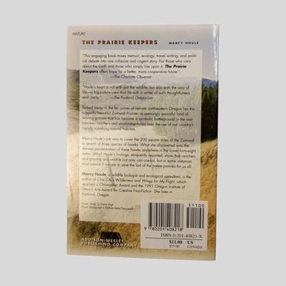 Explore a story that "mixes memoir, ecology, and travel writing" with the back cover of "The Prairie Keepers". The screen displays a vibrant photo of the Oregon prairie at sunset, with text describing Marcy Houle's search for hawks in a symbolic battleground of ranchers and environmentalists. This Fehmerling Books paperback is an essential read for anyone interested in environmental conservation and nature writing.