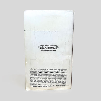 The back cover of the vintage Bantam paperback 'I Ching: A New Interpretation for Modern Times' by Sam Reifler. The weathered white cover features the central quote: 'Love, family, business, friends—every aspect of life. Here is an oracle which all of us can consult'. The detailed blurb explains how the sixty-four hexagrams have been modernized to speak clearly to present needs, offering a true mirror of our lives.