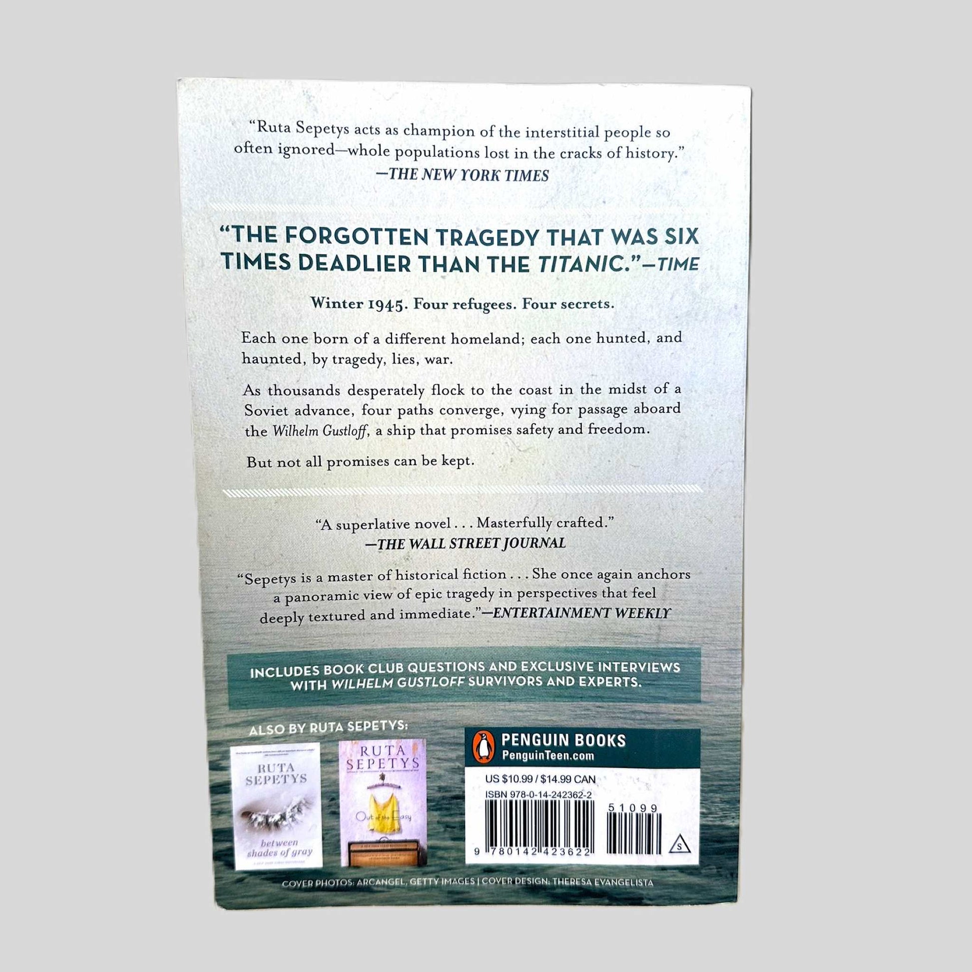 The back cover of the Penguin Books paperback edition of 'Salt to the Sea' by Ruta Sepetys. The layout features a haunting quote from Time describing the story as 'The forgotten tragedy that was six times deadlier than the Titanic'. The summary details the convergence of four refugees in Winter 1945 seeking passage on the Wilhelm Gustloff, documenting the excellent condition of this highly acclaimed YA novel.