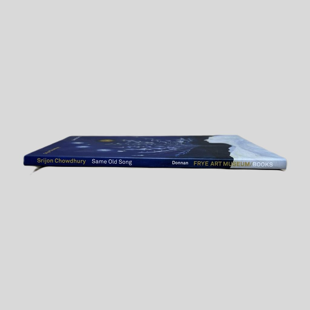 Srijon Chowdhury art exhibition catalog 'Same Old Song' displayed from the side to show the spine and page edges on a neutral gray background
