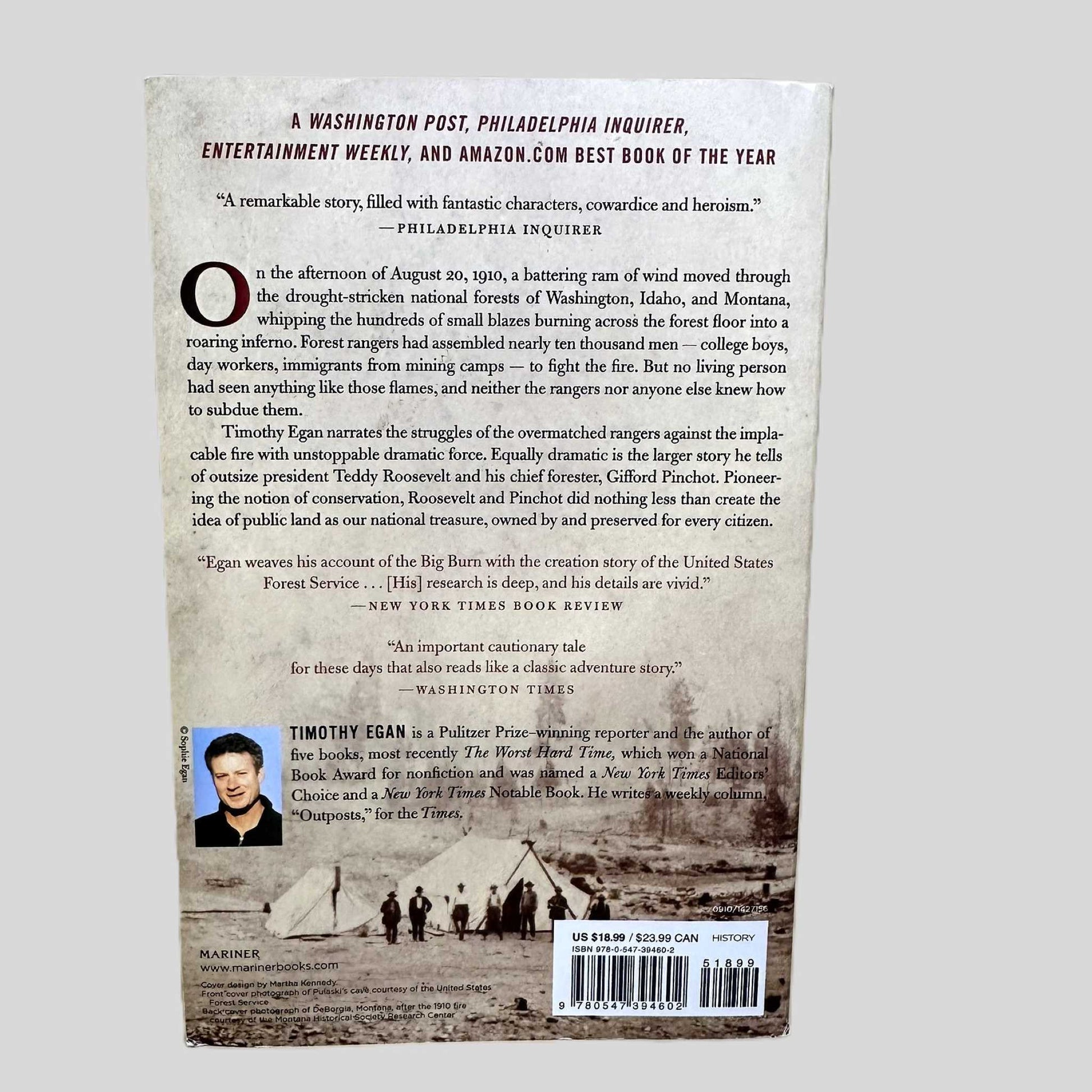 The back cover of the Mariner Books paperback edition of 'The Big Burn: Teddy Roosevelt and the Fire that Saved America' by Timothy Egan. The cover features a dramatic archival photograph of firefighters in a smoky landscape. It displays accolades from the Washington Post and Entertainment Weekly, describing the story of the Great Fire of 1910 and its role in the creation of the United States Forest Service.