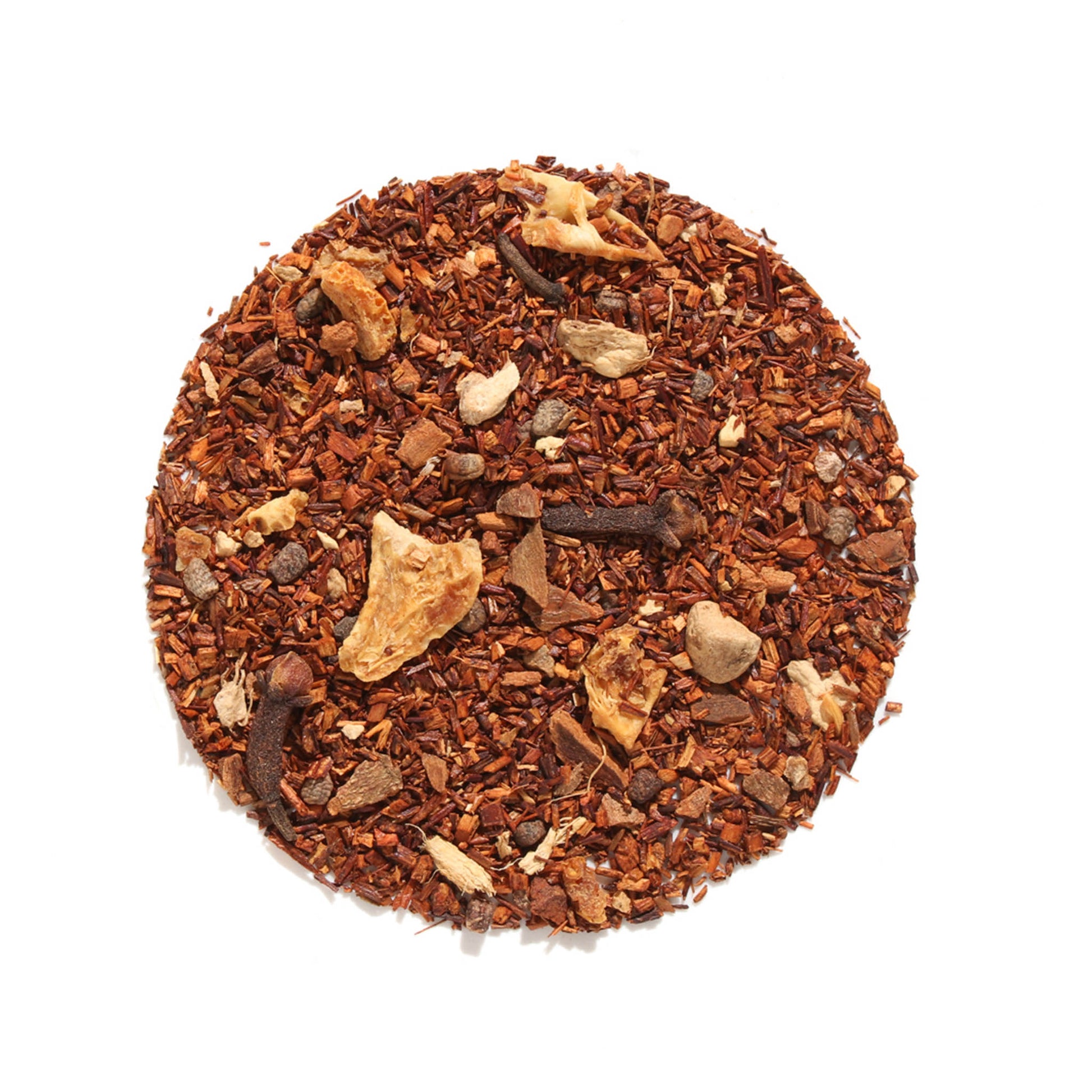Top-down view of Autumn Almond Chai Herbal Tea loose-leaf blend arranged in a circle on a white background, displaying red rooibos, whole cloves, cinnamon bark, and dried almond pieces.