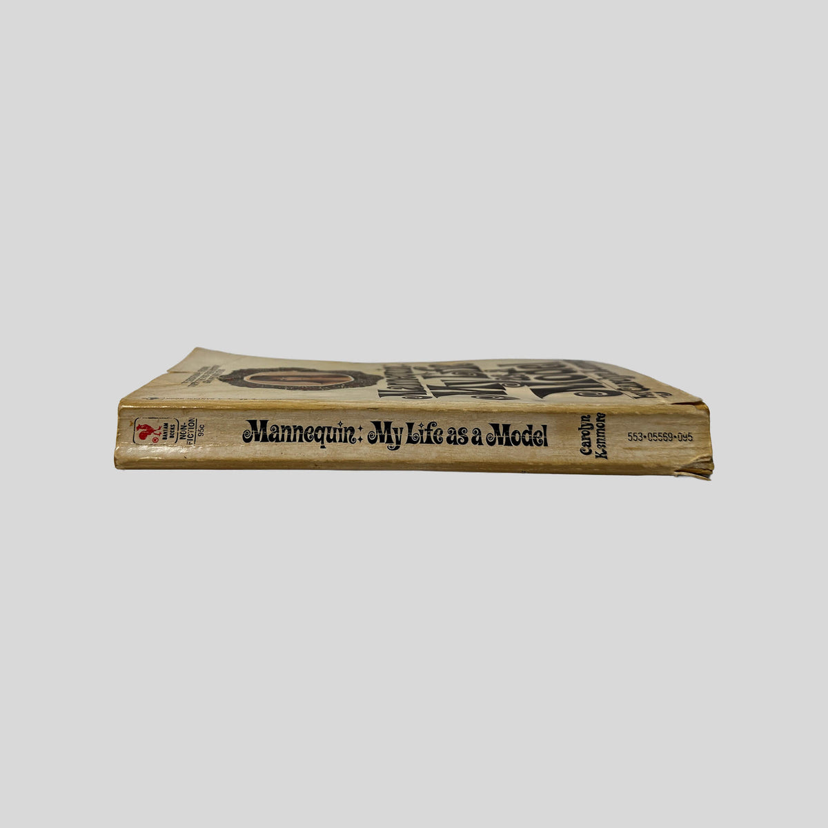 Spine view of Mannequin: My Life As A Model vintage mass market paperback edition by Carolyn Kenmore.