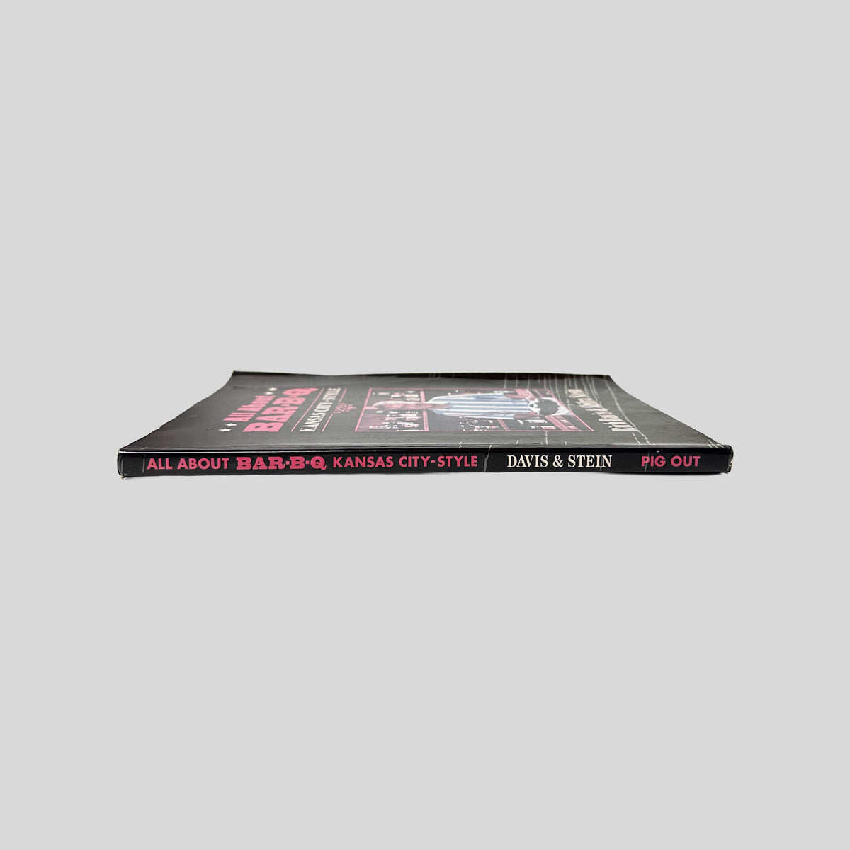 Spine view of Wild About Bar-B-Q Kansas City Style vintage paperback cookbook by Rich Davis.