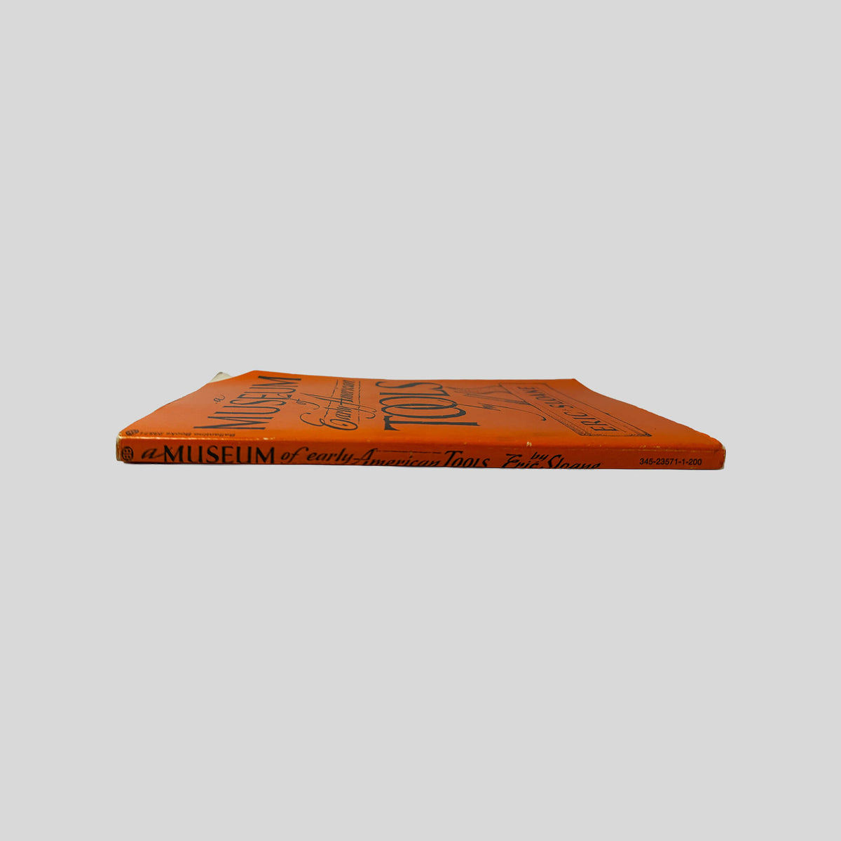 Spine view of A Museum Of Early American Tools vintage paperback edition by Eric Sloane.
