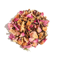 Loose leaf display of Plum Deluxe Evening in the Garden Herbal Tea in a circle shape on a cream background.