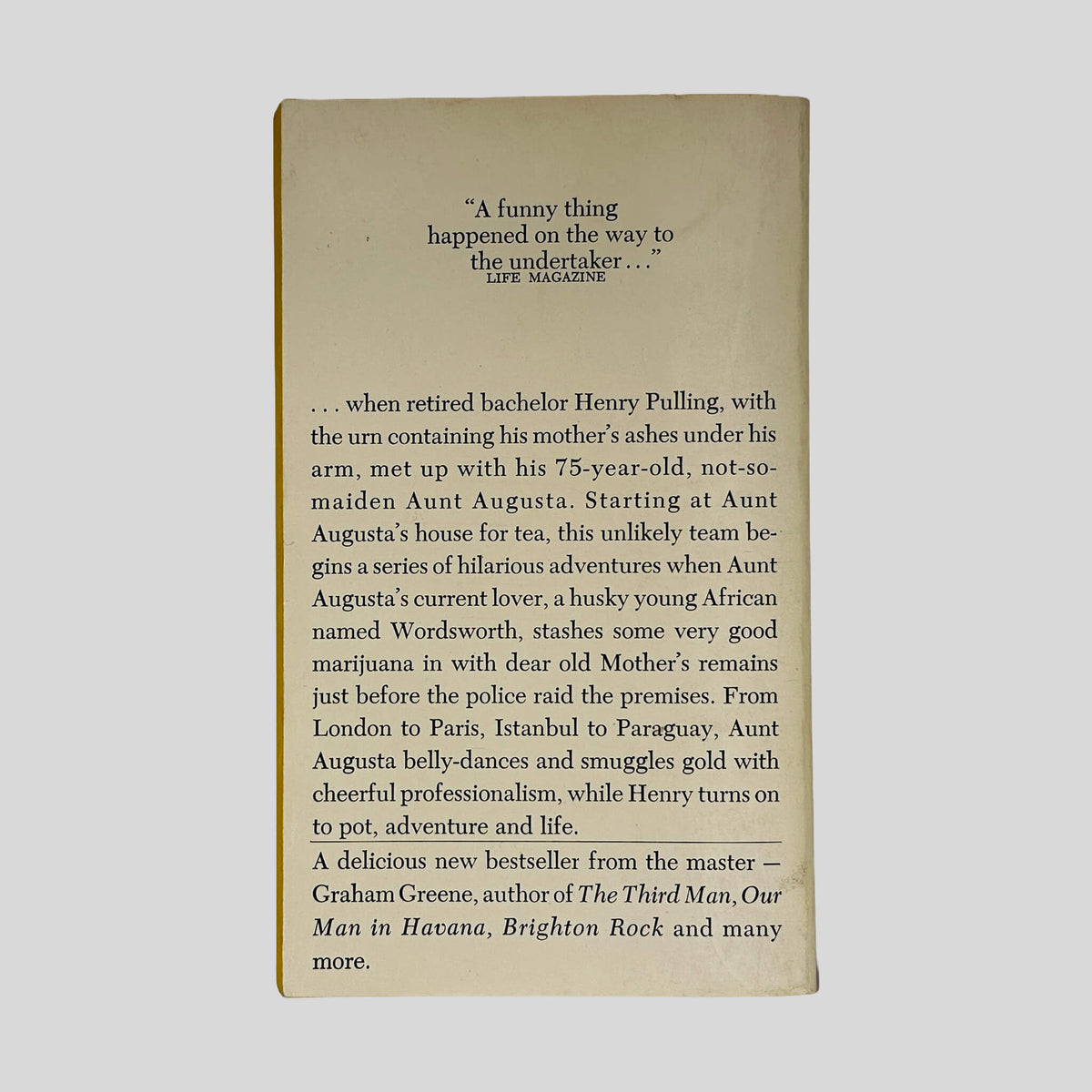 Back cover of Travels With My Aunt by Graham Greene showing back cover blurb and review quotes.