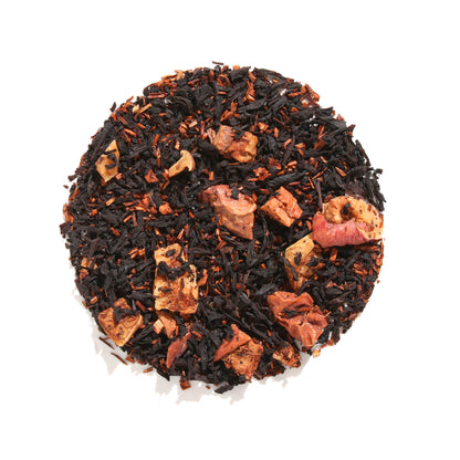 Loose leaf display of Plum Deluxe Halloween Blend Black Tea in a circle shape on a cream background.