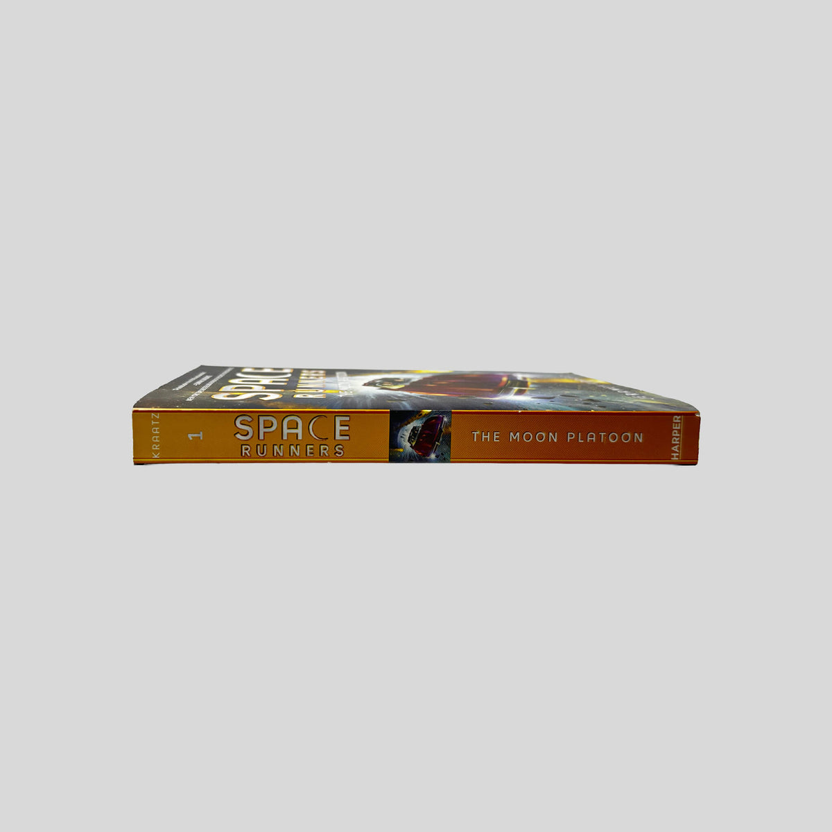 Spine view of Space Runners: The Moon Platoon paperback edition by Jeramy Kraatz.
