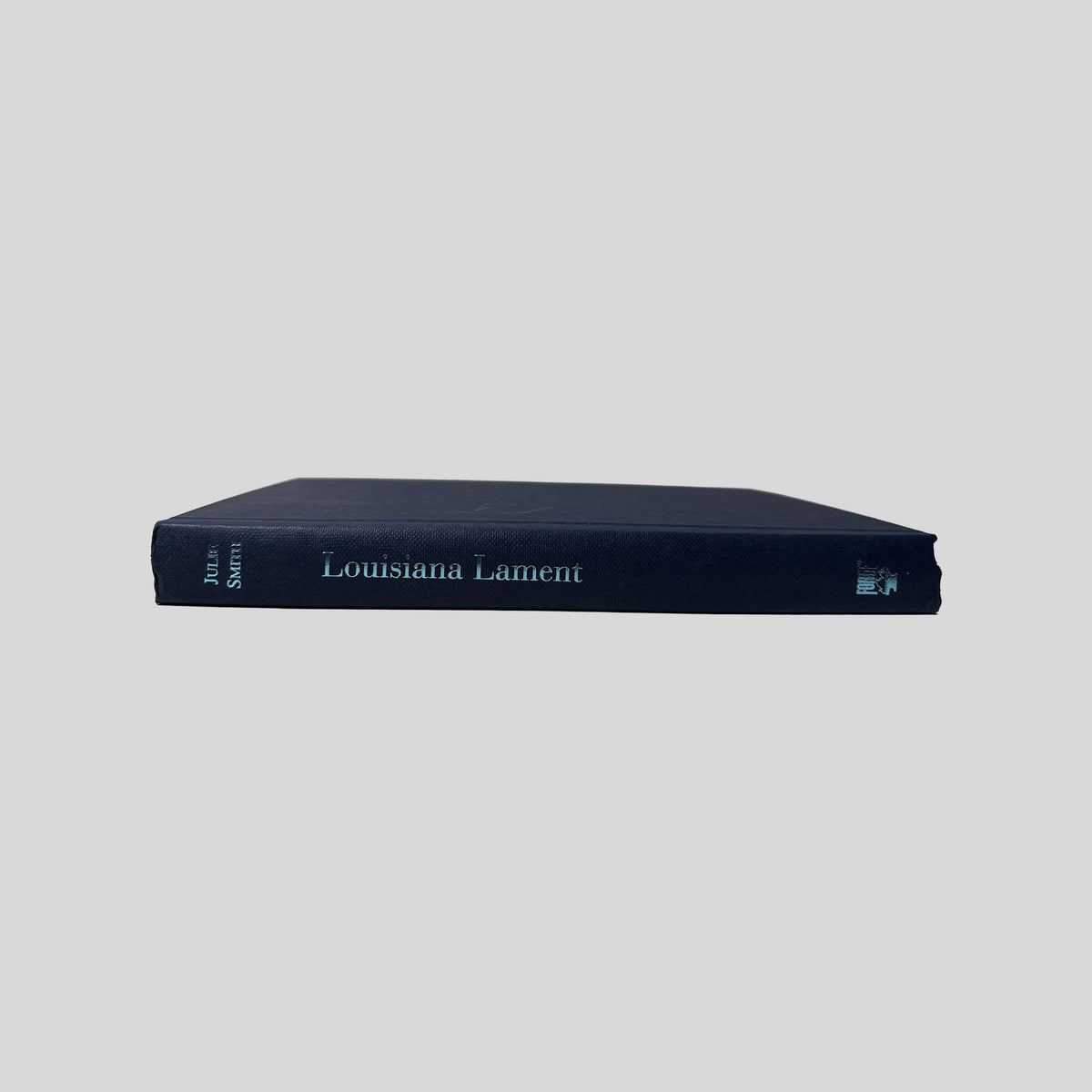 Spine view of Louisiana Lament vintage Forge hardcover edition by Julie Smith.