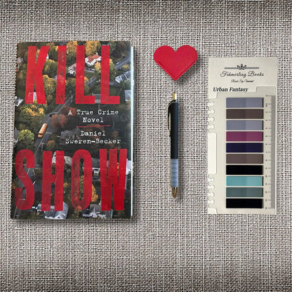 A styled flat-lay featuring Daniel Sweren-Becker's true crime novel 'Kill Show' on the left, a black and silver pen in the center, a heart shaped leather bookmark, and Urban Fantasy annotation tabs from Fehmerling Books, all arranged on a textured beige fabric background.