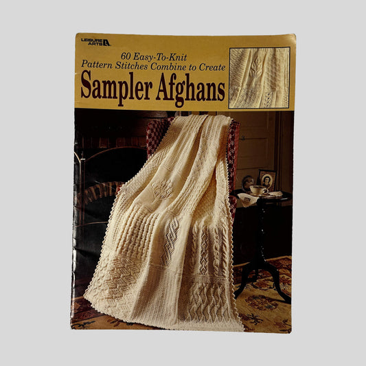 Front cover of 60 Easy-To-Knit Pattern Stitches Combine To Create Sampler Afghans by Leisure Arts, vintage very good condition softcover booklet (Knitting & craft guide).