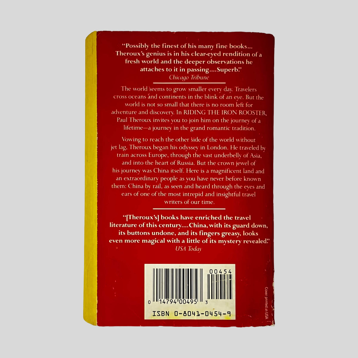 Back cover of Riding the Iron Rooster by Paul Theroux showing back cover summary and review quotes.