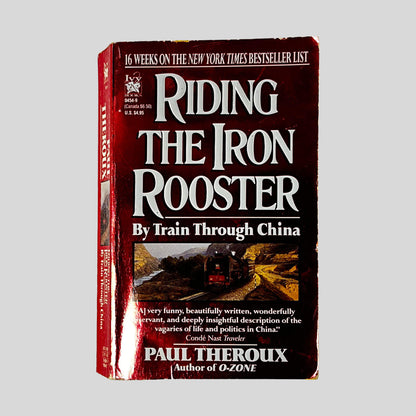 Front cover of Riding the Iron Rooster by Paul Theroux, vintage used paperback edition (Railroad travelogue).