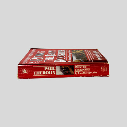 Spine view of Riding the Iron Rooster vintage used paperback edition by Paul Theroux.