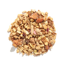 Top-down view of Rejuvenation Lemon Ginger Herbal loose-leaf tea blend displaying coarse pieces of dried ginger, citrus peel, licorice root, and pink rose petals arranged on a white background.