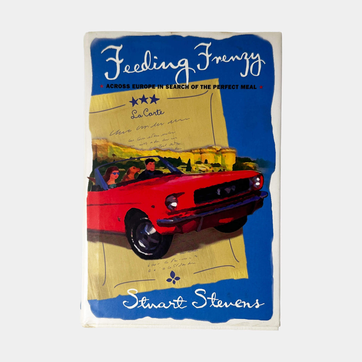 Front cover of Feeding Frenzy by Stuart Stevens, vintage very good condition hardcover edition (Travelogue).
