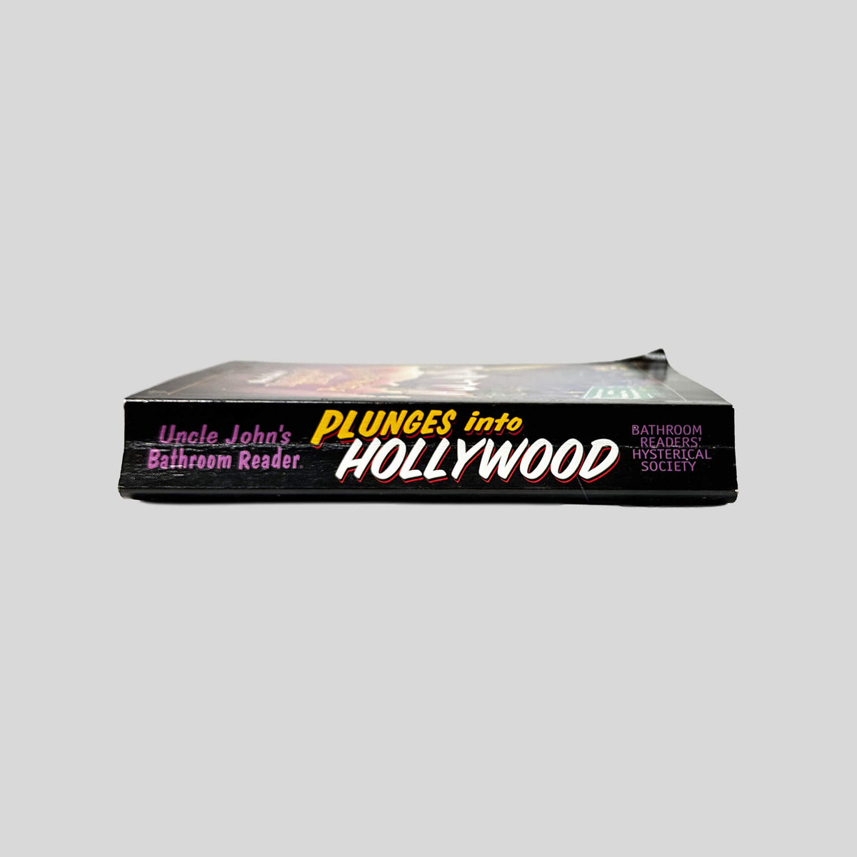 Spine view of Uncle John's Bathroom Reader Plunges Into Hollywood vintage paperback edition.