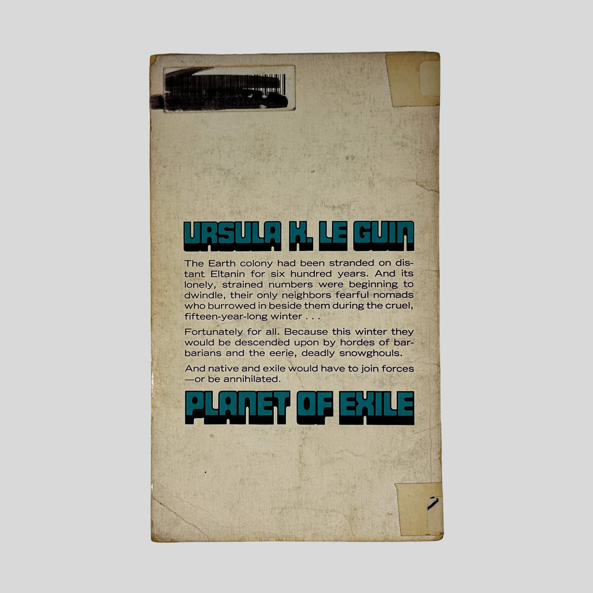 Back cover of Planet Of Exile by Ursula K. Le Guin showing plot summary and series info.